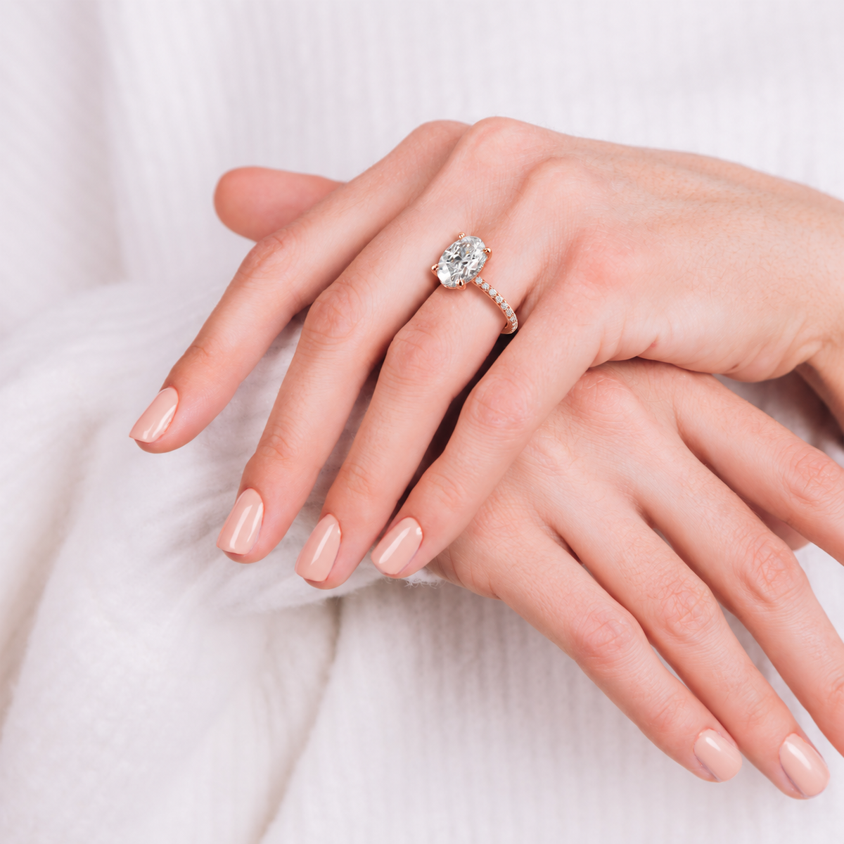 Laura oval engagement ring worn on hand in rose gold