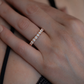 Lucy women’s diamond wedding band worn on hand, rose gold